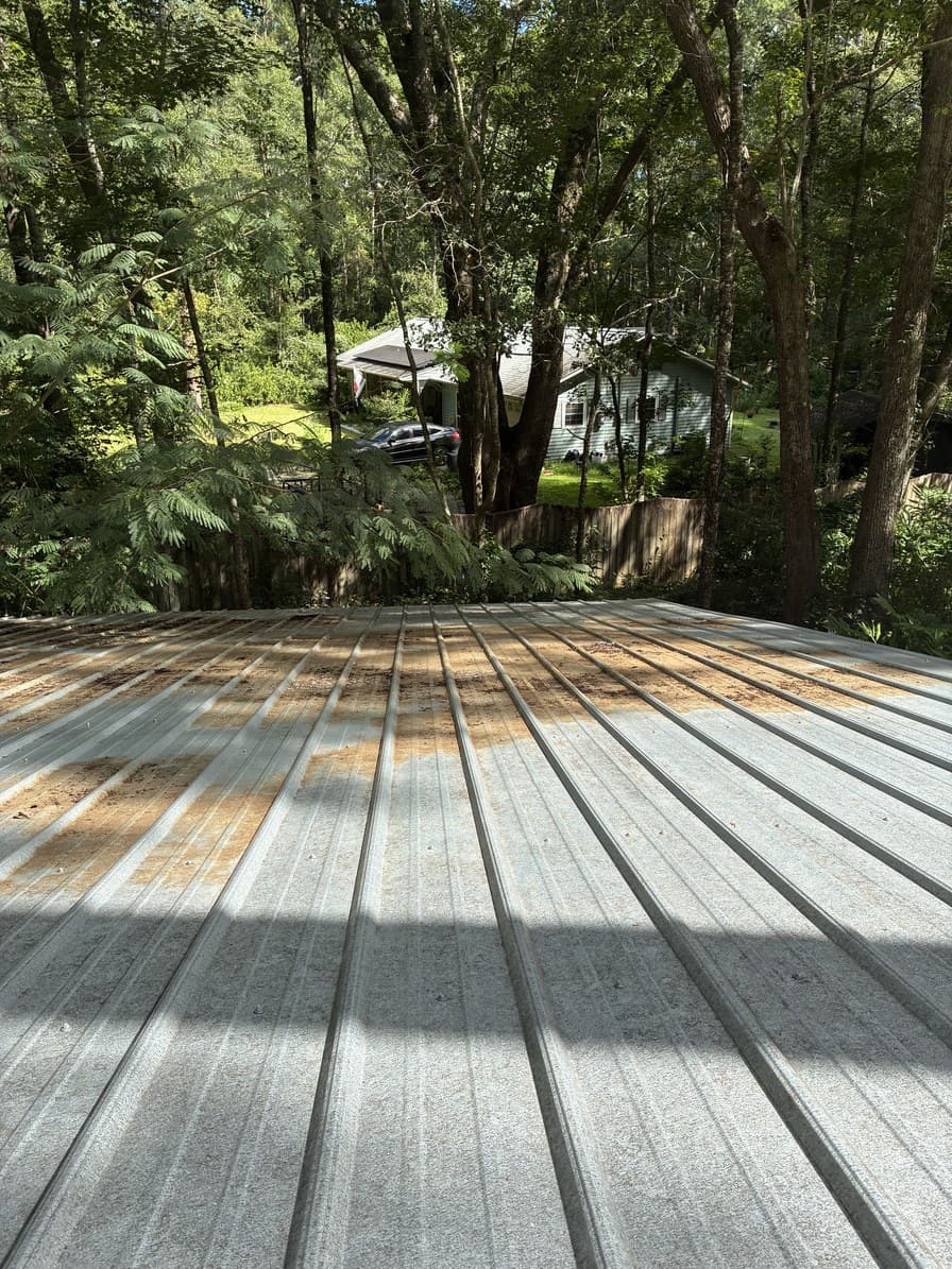 The same roof cleared to bare panel with the water channels running free