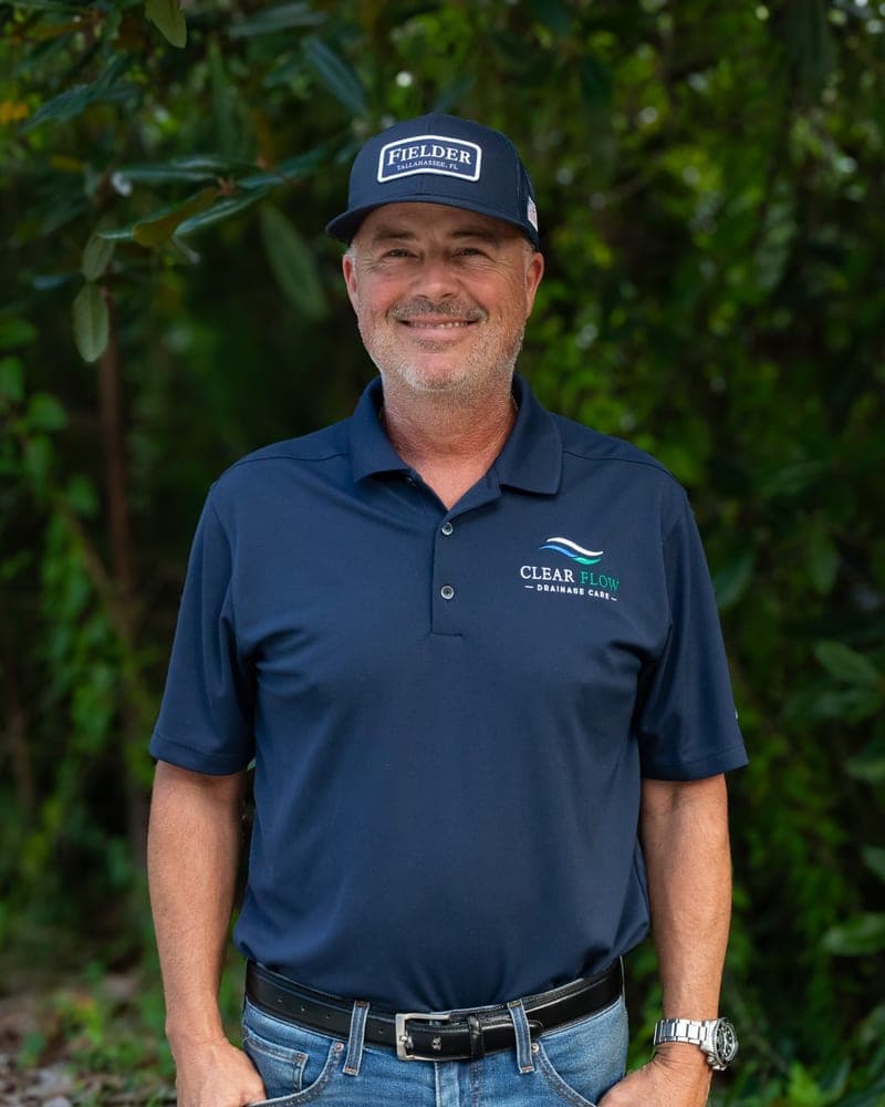 Mitch Allard, Clear Flow property solutions specialist, in a Clear Flow polo and Fielder cap